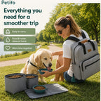 Woman sitting in a park feeding her dog water from a collapsible bowl next to Petifo storage containers.