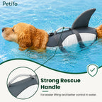 Golden Retriever swimming in a pool wearing a Petifo shark life jacket highlighting the strong rescue handle