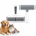 Studio shot of the Petifo pet hair roller showing its textured ergonomic grip and grey cleaning brush head, positioned next to a friendly golden retriever and a tabby cat.