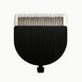 Studio product shot of a black and silver replacement clipper blade attachment featuring fine metal teeth and a ridged casing.