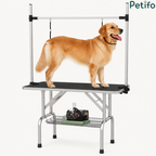 Sturdy foldable pet grooming table with a non-slip surface and accessory storage shelf, featuring a golden retriever standing on it.