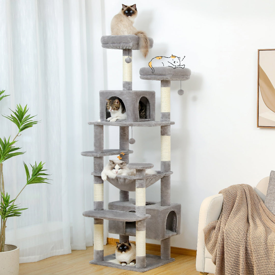 A tall, multi-level grey cat tower featuring multiple platforms, sisal-wrapped scratching posts, a central enclosed condo, and a hanging hammock.