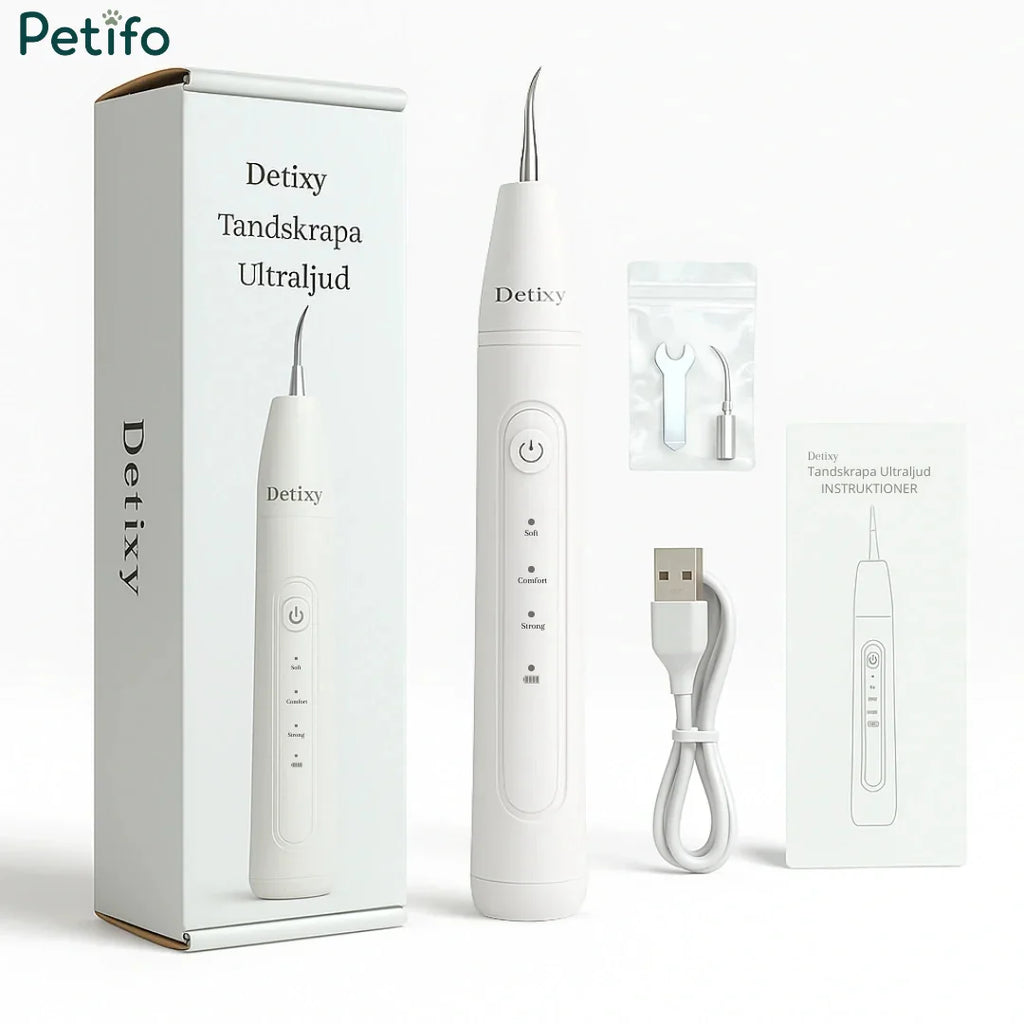 Unboxing layout displaying the Petifo Detixy Ultrasonic Dental Scaler device alongside its product box, replacement cleaning tips, a tightening tool, a USB charging cable, and an instruction manual.