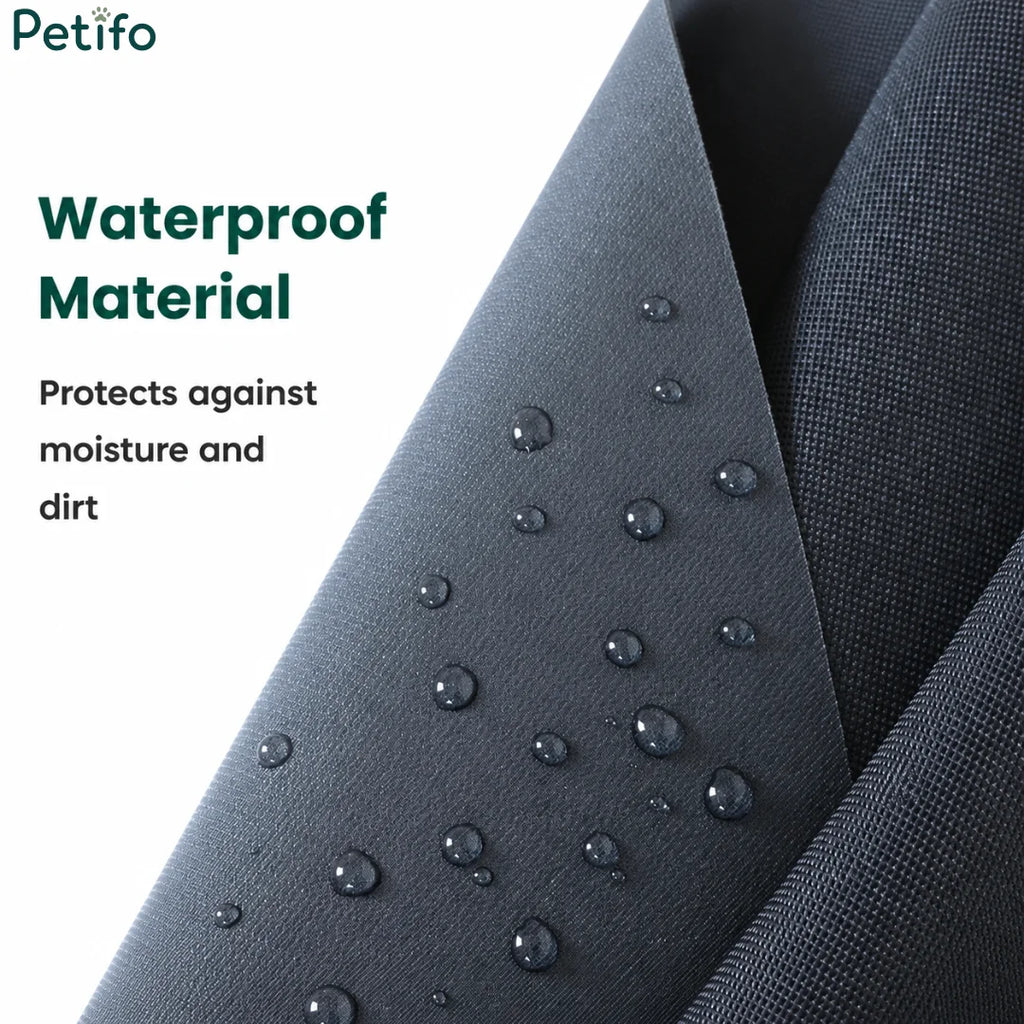 Close-up of waterproof black fabric material covered in water droplets for moisture protection.