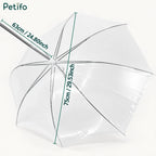 An angle view of the opened clear waterproof dog umbrella highlighting its canopy depth and width measurements.