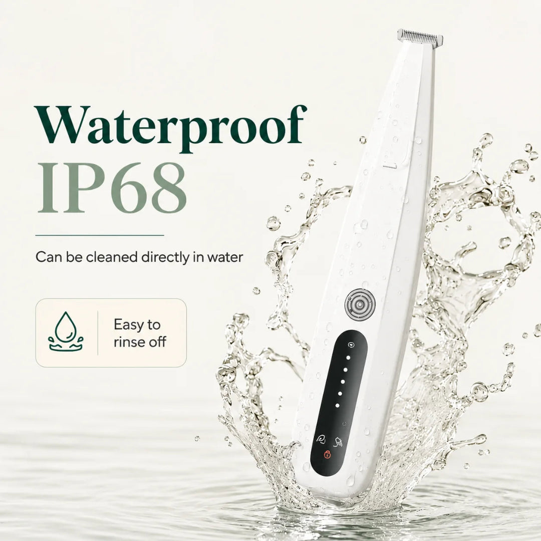 Waterproof IP68 pet paw trimmer being rinsed under splashing water for easy and hygienic cleaning.