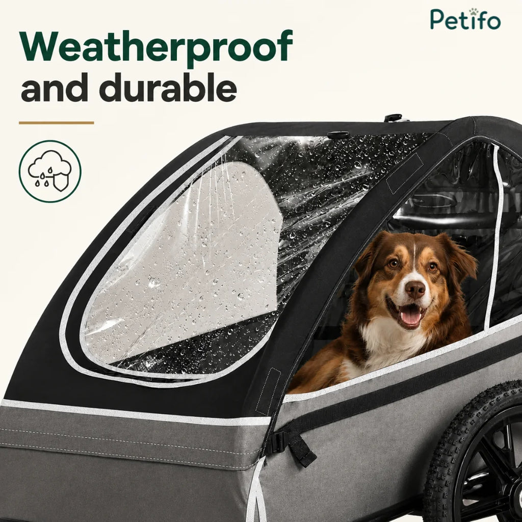 A weatherproof and durable pet carrier trailer featuring a protective cover to keep dogs dry during outdoor travel.