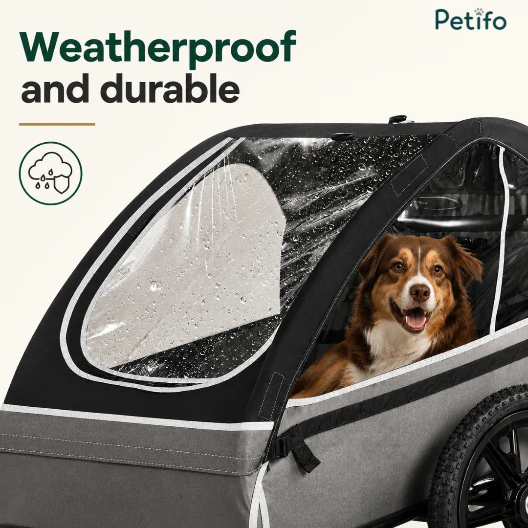 A weatherproof and durable pet carrier trailer featuring a protective cover to keep dogs dry during outdoor travel.