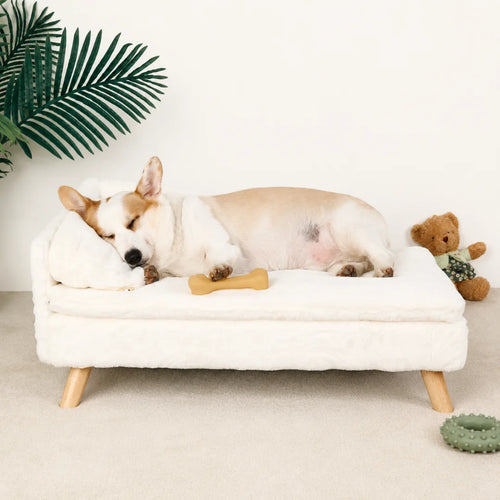 A premium white, plush pet sleeping sofa with wooden legs, designed for comfort and style.