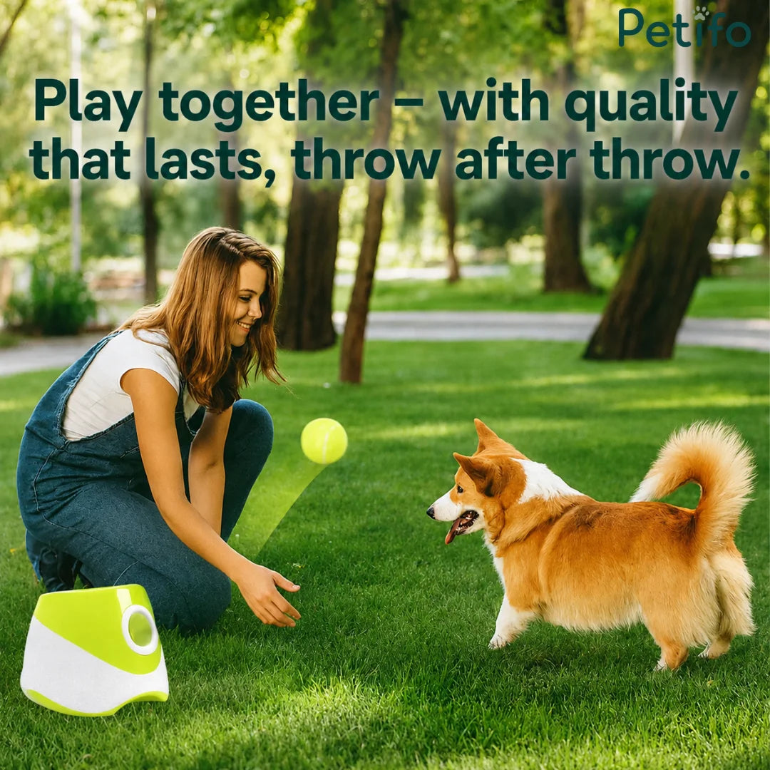 woman playing with her dog in a green park using a portable green automatic ball launcher to throw tennis balls