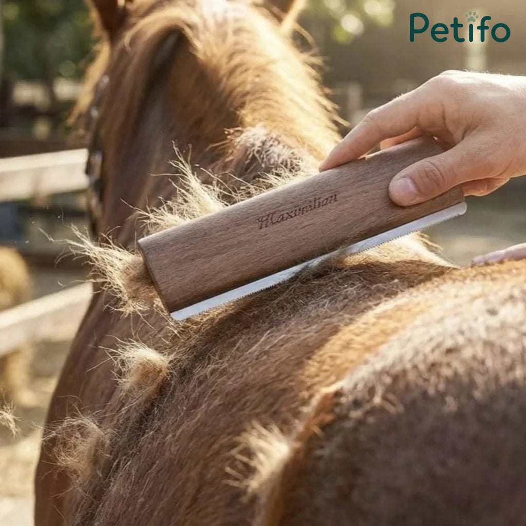 Wooden-handled shedding blade removing thick winter coat hair from a brown horse.