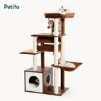 A Petifo cat tree in a living room setting, highlighting the base wooden cabinet that serves as both a storage locker and a private bathroom for cats.