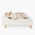 A premium white, plush pet sofa with wooden legs, designed for comfort and style.