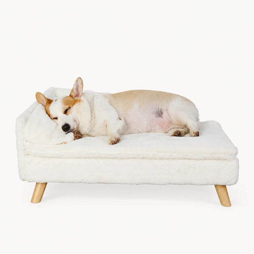 A premium white, plush pet sofa with wooden legs, designed for comfort and style.