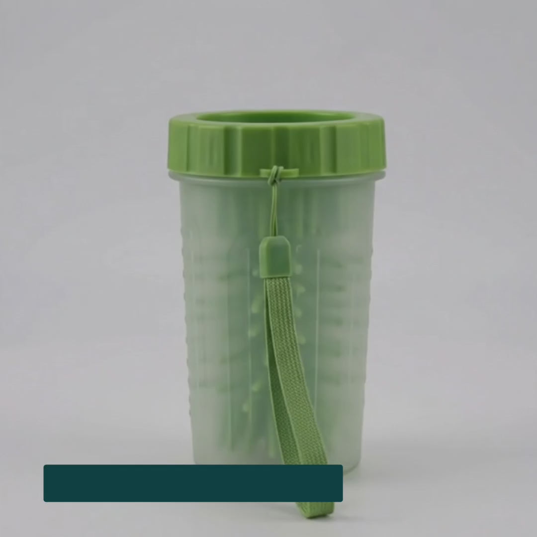 Dipping a muddy paw into the silicone paw cleaner cup – Petifo